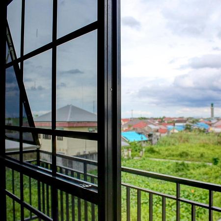 Oyo 90162 Remboelan Guest House Sungai Lutus Esterno foto