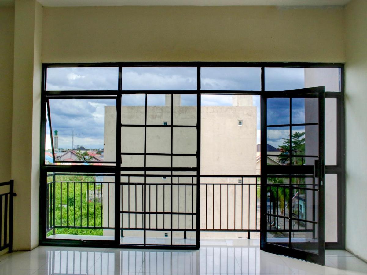 Oyo 90162 Remboelan Guest House Sungai Lutus Esterno foto