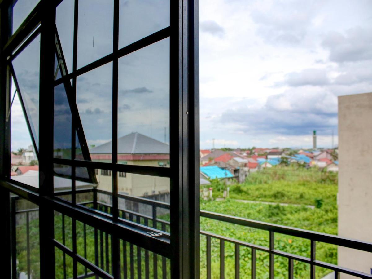 Oyo 90162 Remboelan Guest House Sungai Lutus Esterno foto
